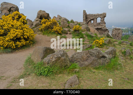 Saint Anthony's Chapel Ruins at Holyrood Park with view across Edinburgh, Scotland behind. Stock Photo