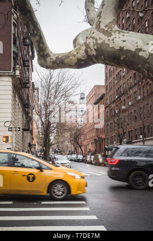 NEW YORK, USA - FEBRUARY 23, 2018: Yellow cab in the residencial streets of Manhattan in New York Stock Photo