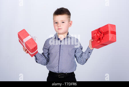 Wellbeing and positive emotions. Celebrate new year valentines day. Birthday gift. Birthday boy. Buy gifts. Child little boy hold gift box. Christmas or birthday gift. Holiday shopping seasonal sale. Stock Photo