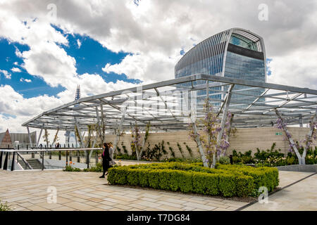 People enjoying the sunshine at The Garden at 120, a roof garden  on the roof of Fen Court office building, City of London, London,UK Stock Photo