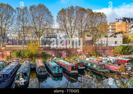 A line of narrowboats moored up at Lisson Grove ,West London on a sunny winter afternoon on The Regents Canal ,London ,UK Stock Photo