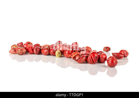 Lot of whole peruvian pink pepper line isolated on white background Stock Photo