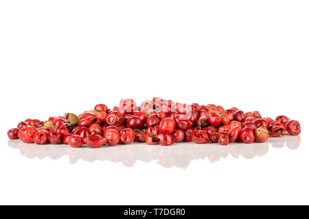 Lot of whole peruvian pink pepper stack isolated on white background Stock Photo