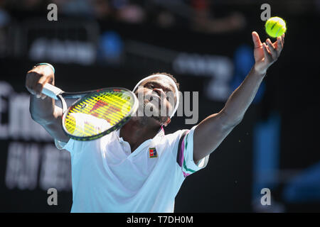 American tennis player Frances Tiafoe playing service shot in Australian Open 2019 tennis tournament, Melbourne Park, Melbourne, Victoria, Australia Stock Photo