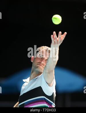 Bulgarian tennis player Grigor Dimitrov playing service shot in Australian Open 2019 tennis tournament, Melbourne Park, Melbourne, Victoria, Australia Stock Photo