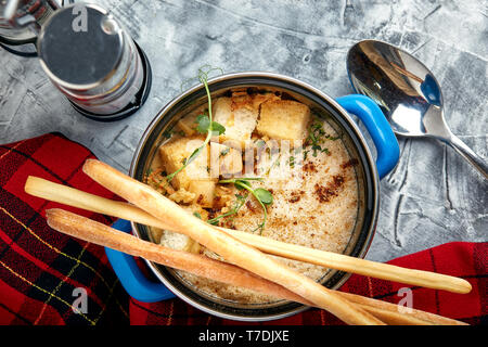 Beef stroganoff with mashed potatoes in a pot. top view, stone background Stock Photo