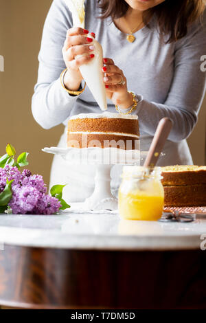 Woman preparing a cake Stock Photo
