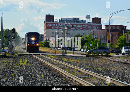 The Amtrak train Piedmont pulls out of the station in downtown Durham North Carolina on its way to Raleigh. Stock Photo