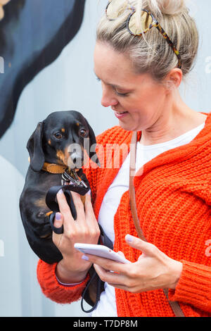 Boscombe, Bournemouth, Dorset, UK. 6th May 2019. Dachshund Dash, part of Bournemouth Emerging Arts Fringe (BEAF) Festival invites dachshunds and their owners to gather under the Daschund artwork to see how many they can gather in one place. Credit: Carolyn Jenkins/Alamy Live News