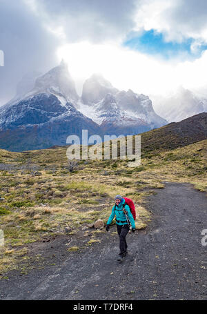 April 2019: A hiker along the Mirador Cuernos trail, Torres del Paine National Park, Patagonia, Chile. Stock Photo