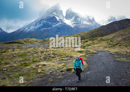 April 2019: A hiker along the Mirador Cuernos trail, Torres del Paine National Park, Patagonia, Chile. Stock Photo