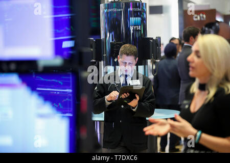 New York, USA. 6th May, 2019. A trader works at the New York Stock Exchange in New York, the United States, on May 6, 2019. U.S. stocks ended lower on Monday, with the three major indexes all reporting losses during the first trading day of the week. The Dow Jones Industrial Average was down 66.47 points, or 0.25 percent, to 26,438.48. The S&P 500 fell 13.17 points, or 0.45 percent, to 2,932.47. The Nasdaq Composite Index fell 40.71 points, or 0.50 percent, to 8,123.29. Credit: Wang Ying/Xinhua/Alamy Live News Stock Photo