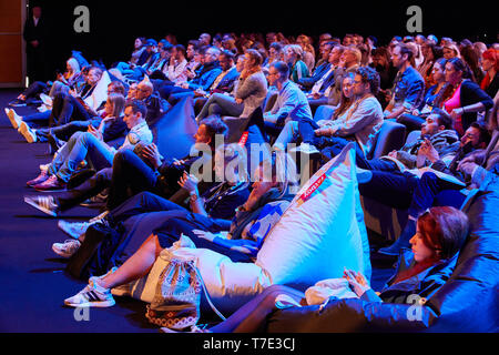 Hamburg, Germany. 07th May, 2019. Visitors watch a talk at the marketing trade fair 'Online Marketing Rockstars' (OMR) in the exhibition halls. Credit: Georg Wendt/dpa/Alamy Live News Stock Photo
