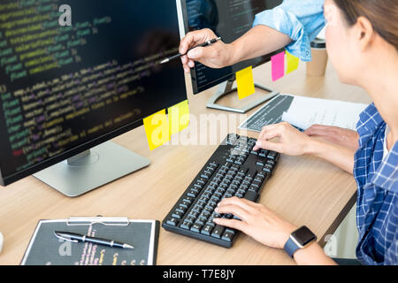 IT office Programmers software development coding technologies On Computer working in a company office. Stock Photo