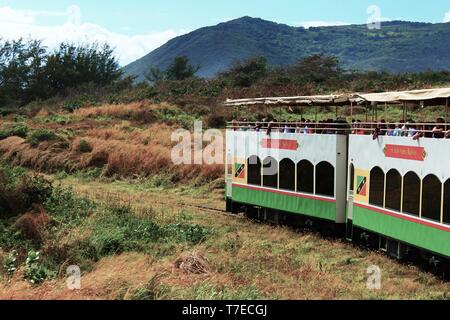 St Kitts, Caribbean - March 1st 2018: The St Kitts Scenic Railway tourist attraction travels through the countryside full of sightseeing tourists.