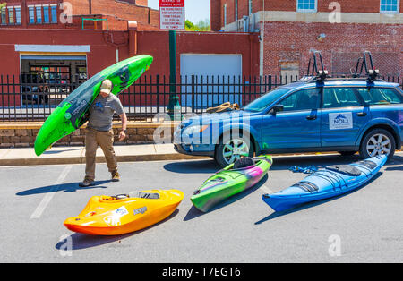 JOHNSON CITY, TN, USA-4/27/19: A selection of kayaks on display at a Saturday farmers' market in Johnson City. Stock Photo
