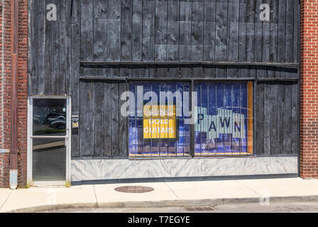 JOHNSON CITY, TN, USA-4/27/19: Albert's Loan & Pawn Shop: guns, gold, guitars: weathered plank store front. Stock Photo