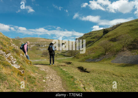 Men socialising: Seniors enjoying views over Trollerdale from the path to Troller's Gill near Appletreewick, Yorkshire Dales Stock Photo