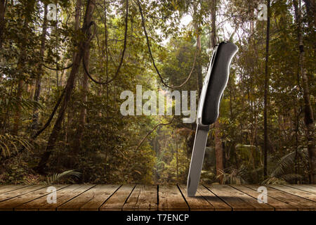 Folding multitool knife in a jungle Stock Photo