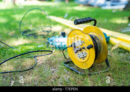 electric cable hub in the field grass garden at noon Stock Photo