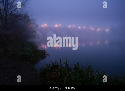 Foggy morning at Chertsey bridge Stock Photo