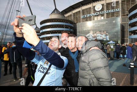 Fans take a selfie outside the Etihad Stadium, Manchester. Stock Photo