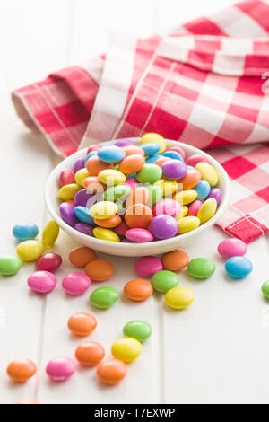 Colorful chocolate candy pills in bowl. Stock Photo