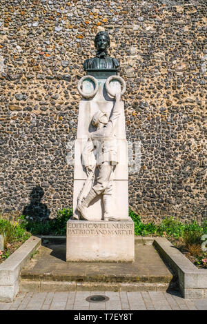 Statue of nurse Edith Cavell outside Norwich Cathedral, Norwich, Norfolk, UK. Stock Photo