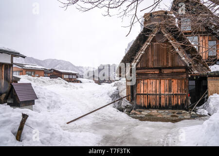 Villages of Shirakawago and Gokayama are one of Japan's UNESCO World Heritage Sites. Farm house in the village and mountain behind. Stock Photo