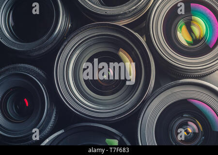 Set of various DSLR lenses with colorful reflections Stock Photo