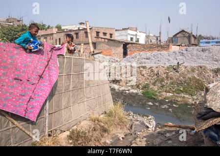 Children are seen as they play in leather processing area (tanneries district) in Dhaka, Bangladesh Stock Photo