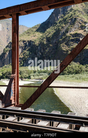 Metal bridge over Urubamba River on the railway to Aguas Calientes and Machu Picchu in Peru Stock Photo