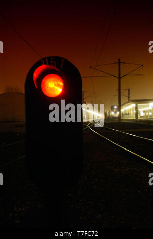 Red light on the railroad at night Stock Photo