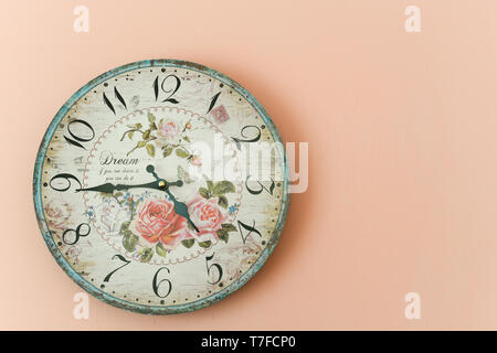 Wall clock on the pink wall Stock Photo