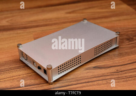 External hdd drive on wooden background Stock Photo