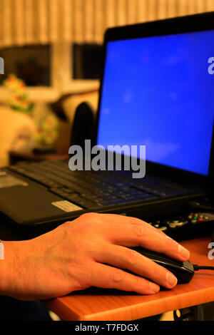 Senior hand using laptop close up view Stock Photo