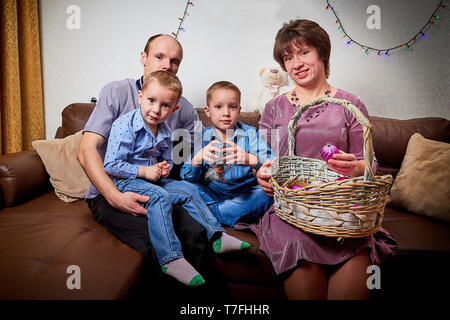 Happy family with two children cheerfully spend house time before Christmas Stock Photo