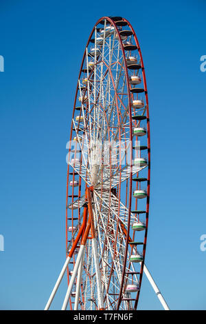 Detail of a ferris wheel over blue sky background Stock Photo