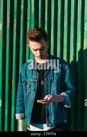 Young man using smartphone Stock Photo