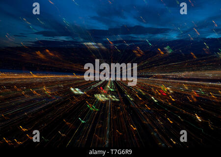 The greater Wenatchee area early morning before sunrise along the Columbia River lights still on as the sky lightens using a zooming effect. Stock Photo