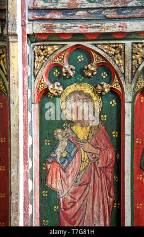 Detail of the medieval panel painting of St John the Baptist in the rood screen of the Church of St Peter at Belaugh, Norfolk, England, UK, Europe. Stock Photo