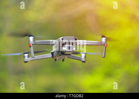 Galati, Romania - April 20, 2019: Dji Mavic 2 Pro with Hasselblad camera hovering inside a forrest in bright daylight Stock Photo