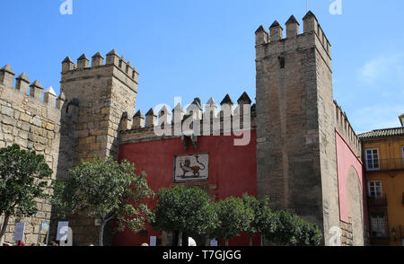 Spain. Andalusia. Seville. Royal Alcazar. Exterior wall and the Lion Gate or Gate of the Hunt. Stock Photo