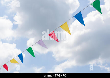 Garland Pennants Flags Decoration against the blue sky Stock Photo