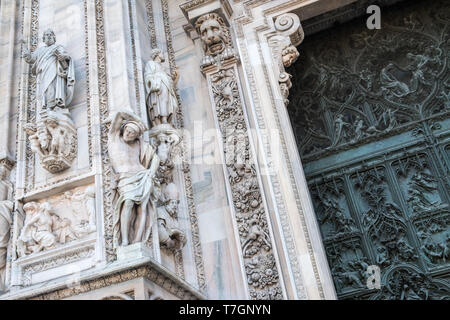 Architectural closeup of ornate decorative details on exterior of gothic Milan Cathedral (Duomo), Milan, Italy