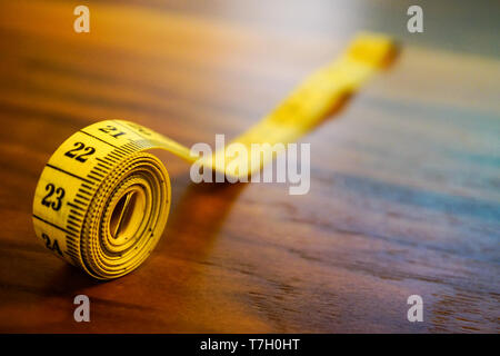 Rolled measuring tape close up view Stock Photo