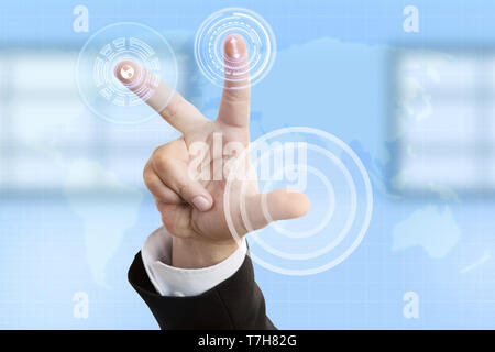 Businessman wearing suit pressing buttons on transparent touchscreen with index finger closeup Stock Photo