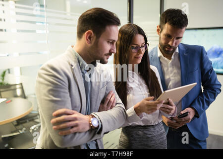 Picture of businesspeople using digital tablet in office Stock Photo