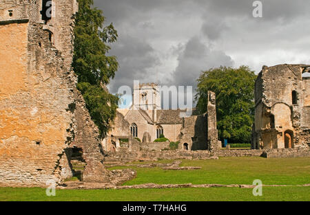 Minster Lovell Hall ruins and Church Cotswolds Oxfordshire. So named after St Kenelm's Minster, the village church. Stock Photo