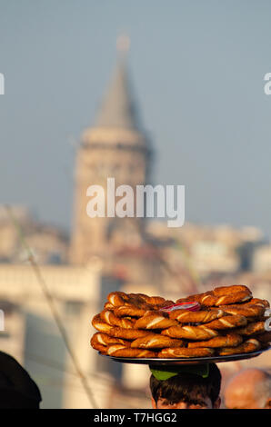 Popular Turkish Street Food, Simit,  near the Galata Tower, Istanbul, Turkey Stock Photo